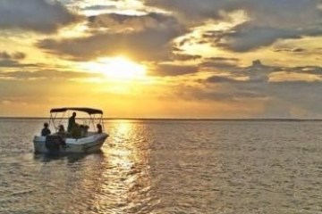 a sunset over a body of water