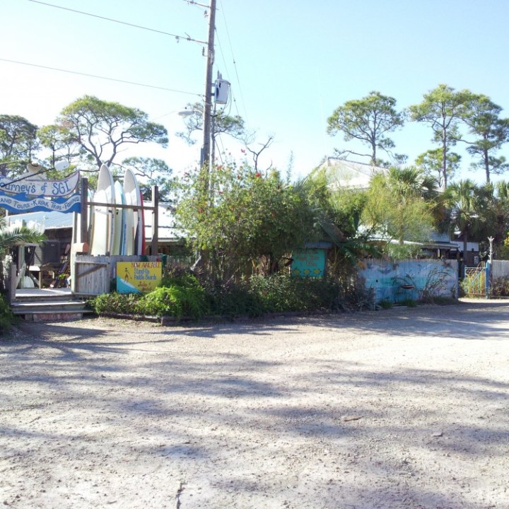 a truck driving down a dirt road