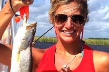 a person holding a fish