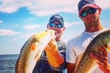 a man holding a fish