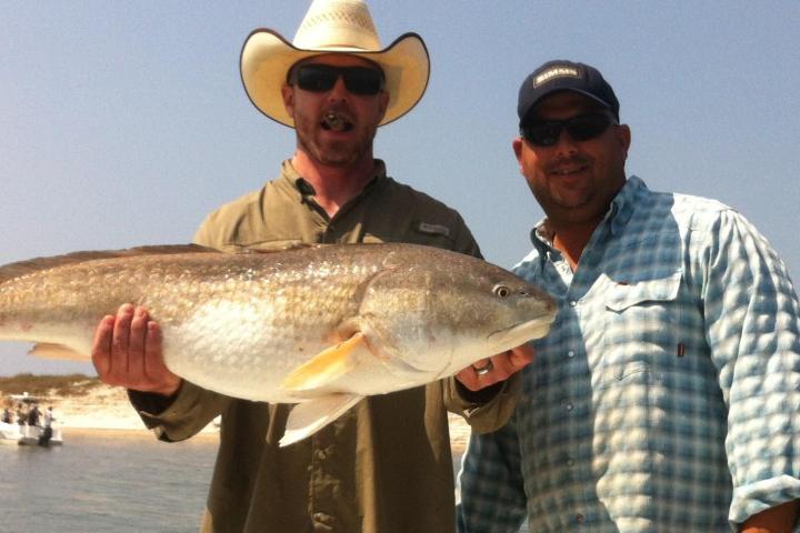 a man holding a fish