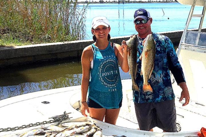 a group of people that are standing in the water