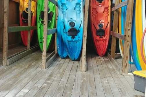 a yellow boat sitting on top of a wooden door