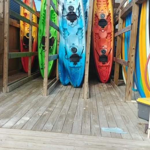 a yellow boat sitting on top of a wooden door