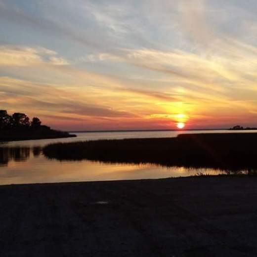 a sunset over a body of water