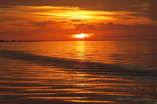 a sunset over a body of water