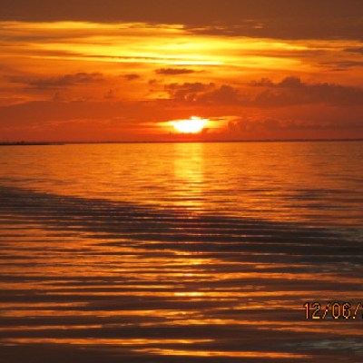 a sunset over a body of water