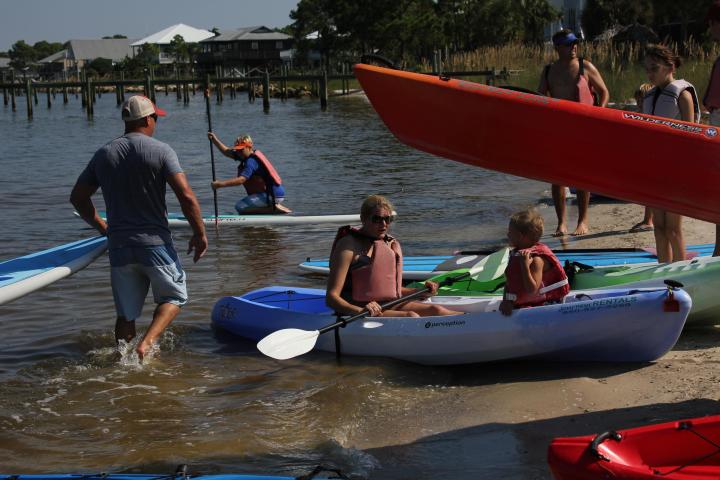 a group of people on a boat in the water