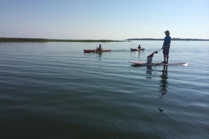 a group of people in a boat on a body of water
