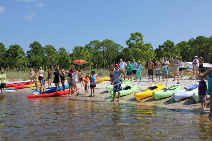 a group of people on a boat in the water