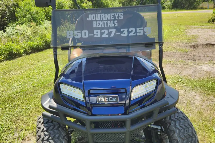 a car parked in a grassy field