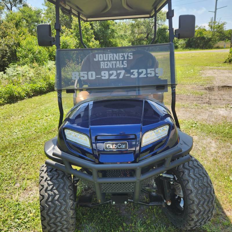 a car parked in a grassy field