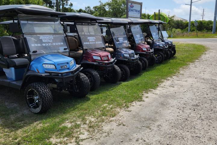 a car driving down a dirt road