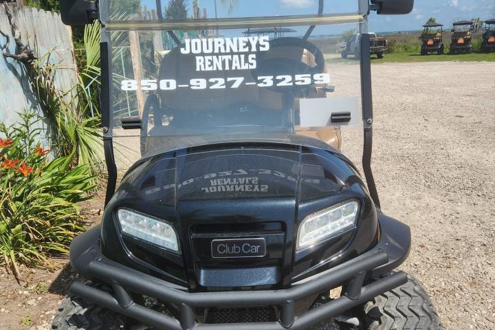 a car parked on a dirt road