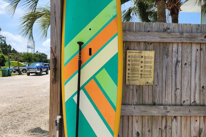 a sign on the side of a fence